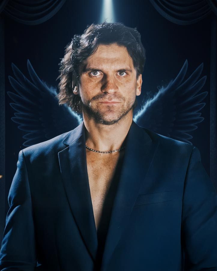 ANGEL4MUSIC — Rainer Engel on a darkened stage, lit from above