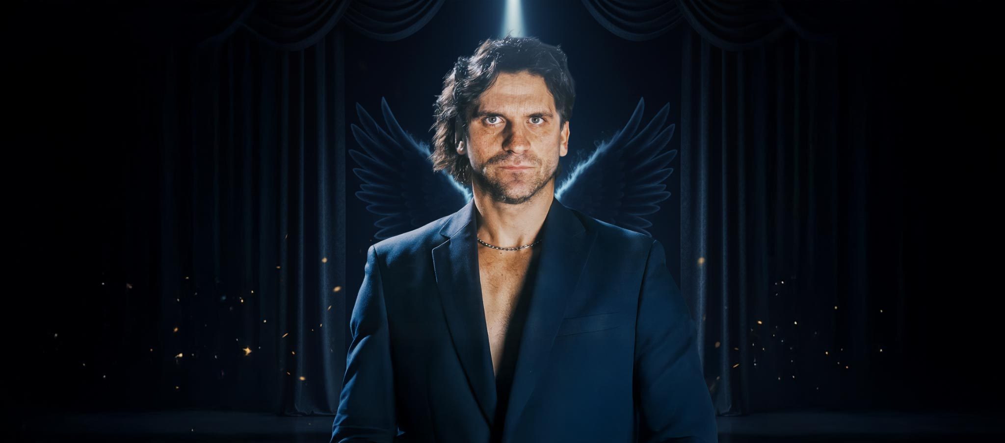 ANGEL4MUSIC — Rainer Engel on a darkened stage, lit from above